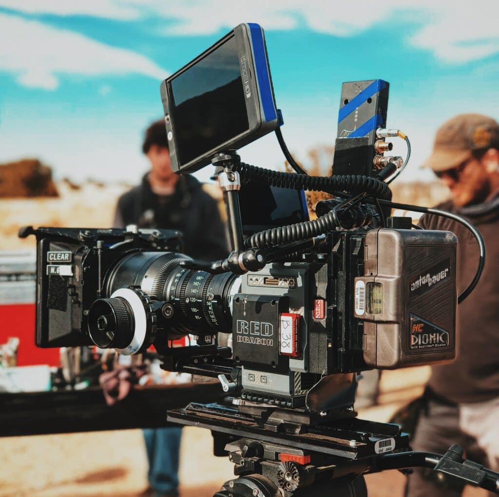 A camera on a tripod capturing the desert landscape.